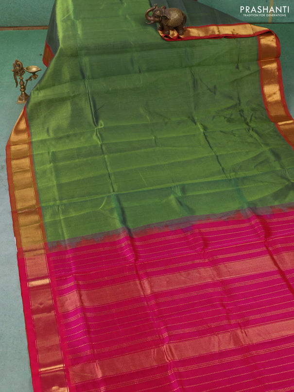 Silk cotton saree green and pink with plain body and zari woven border