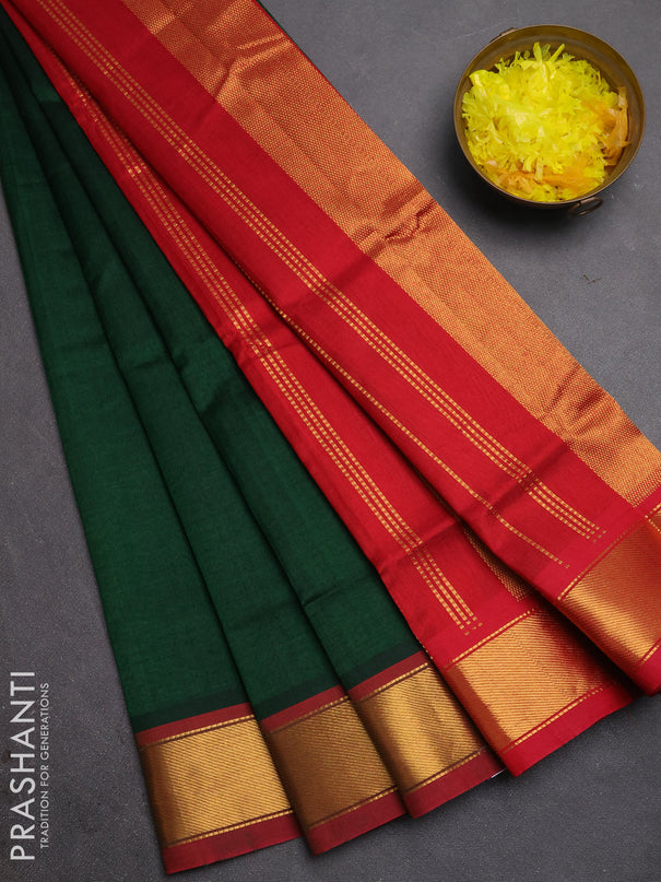 Silk cotton saree bottle green and maroon with plain body and zari woven border