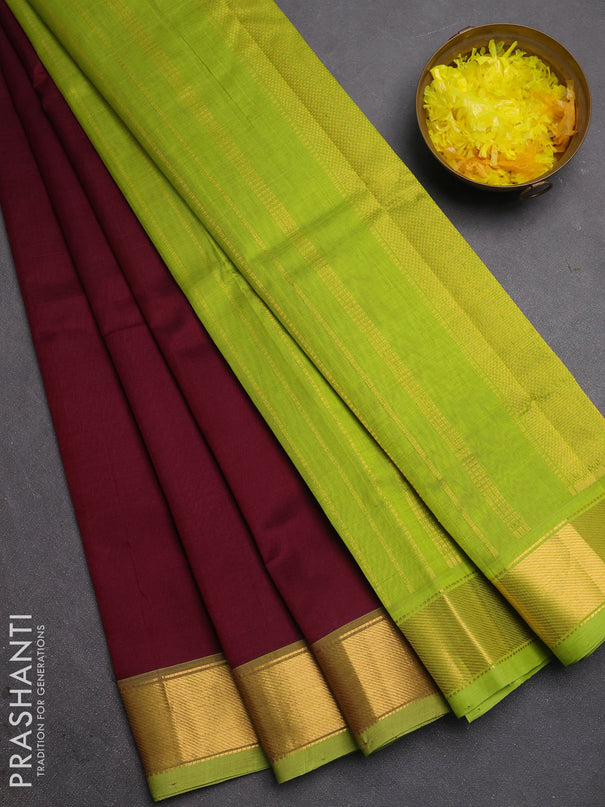 Silk cotton saree deep wine and light green with plain body and zari woven border
