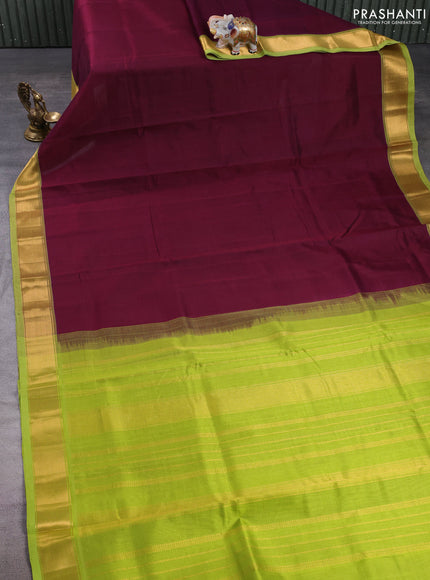 Silk cotton saree deep wine and light green with plain body and zari woven border