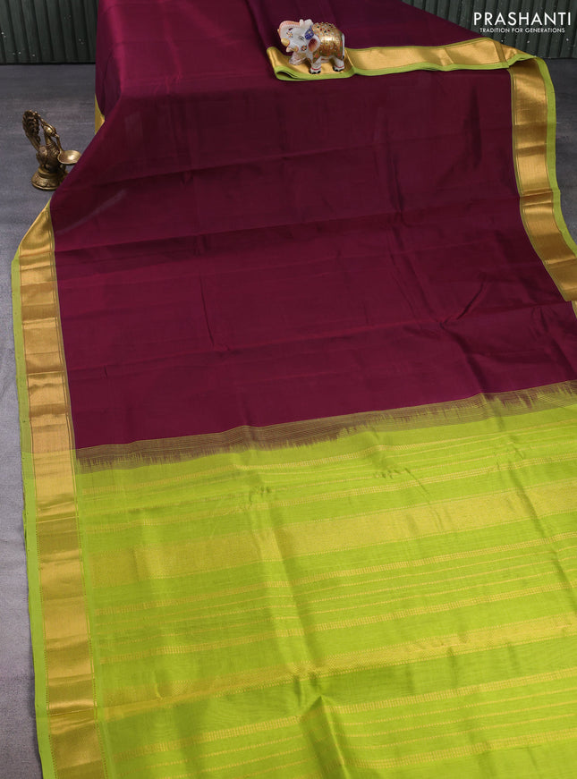 Silk cotton saree deep wine and light green with plain body and zari woven border