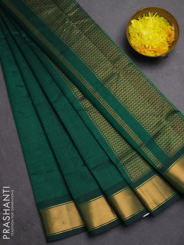 Silk cotton saree bottle green with plain body and zari woven border