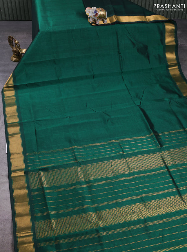 Silk cotton saree bottle green with plain body and zari woven border