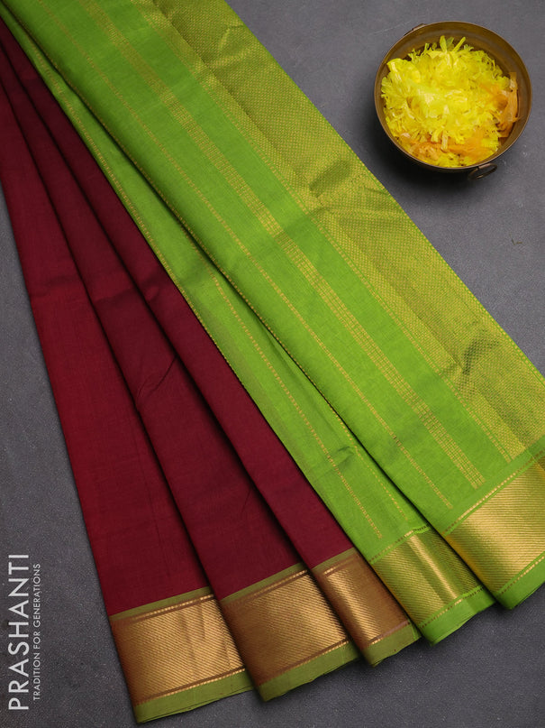 Silk cotton saree deep maroon and light green with plain body and zari woven border