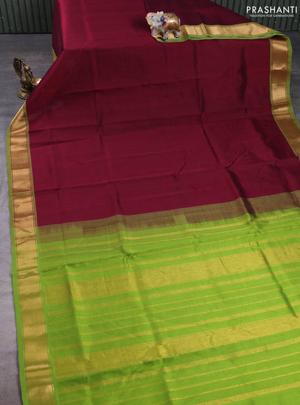 Silk cotton saree deep maroon and light green with plain body and zari woven border