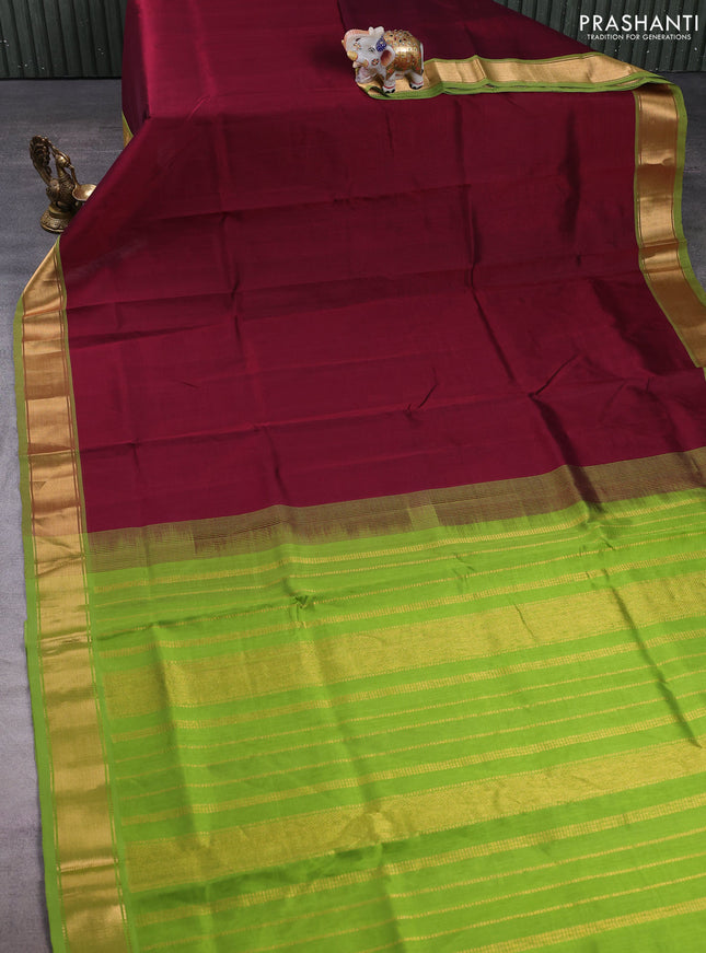 Silk cotton saree deep maroon and light green with plain body and zari woven border