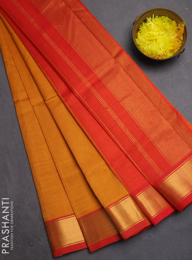 Silk cotton saree mustard yellow and red with plain body and zari woven border