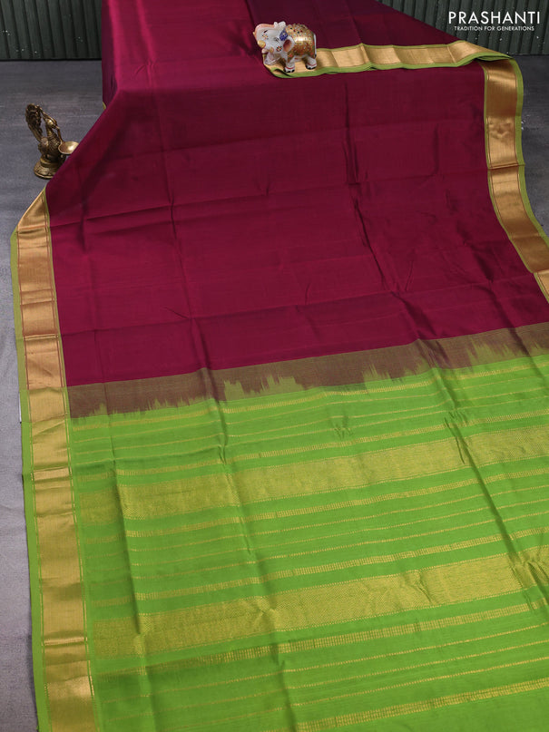 Silk cotton saree wine shade and light green with plain body and zari woven border