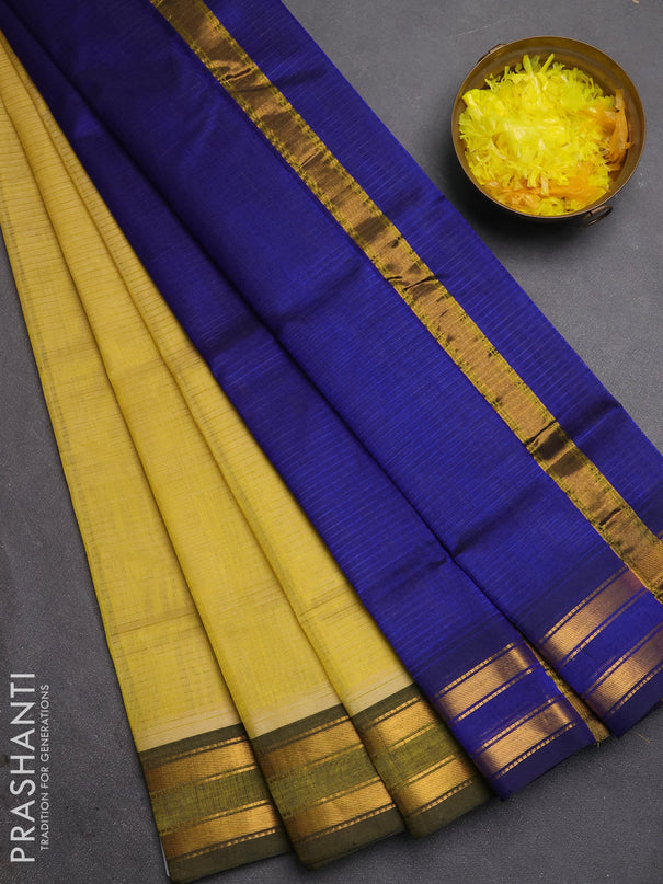 Silk cotton saree pale yellow and royal blue with plain body and zari woven border