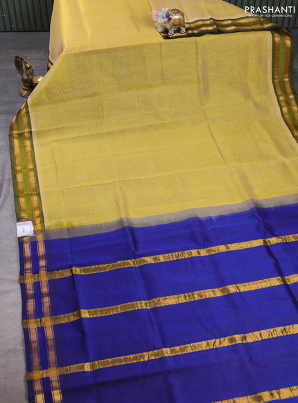 Silk cotton saree pale yellow and royal blue with plain body and zari woven border