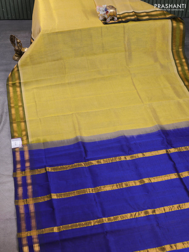 Silk cotton saree pale yellow and royal blue with plain body and zari woven border