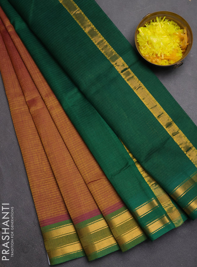 Silk cotton saree dual shade of dark mustard and green with plain body and zari woven border