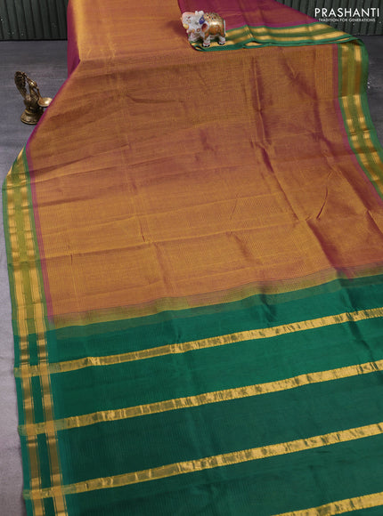 Silk cotton saree dual shade of dark mustard and green with plain body and zari woven border