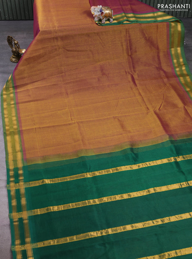 Silk cotton saree dual shade of dark mustard and green with plain body and zari woven border