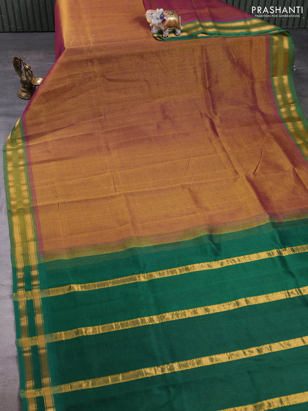 Silk cotton saree dual shade of dark mustard and green with plain body and zari woven border