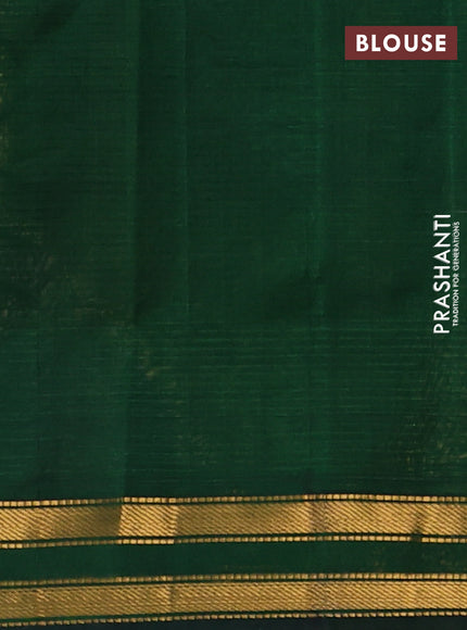 Silk cotton saree pale yellow and bottle green with plain body and zari woven border