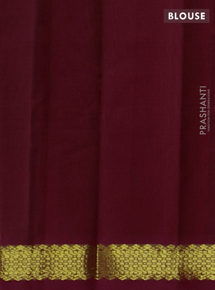 Silk cotton saree bottle green and maroon with plain body and zari woven border
