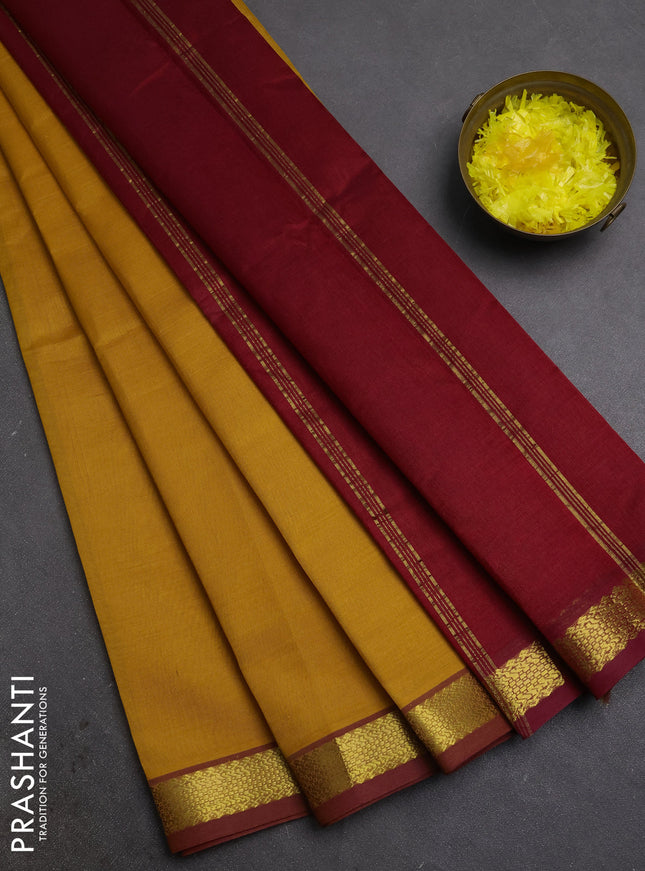 Silk cotton saree mustard yellow and maroon with plain body and zari woven border