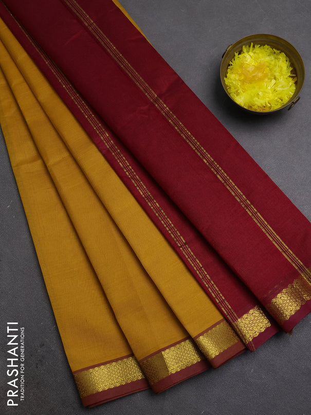 Silk cotton saree mustard yellow and maroon with plain body and zari woven border