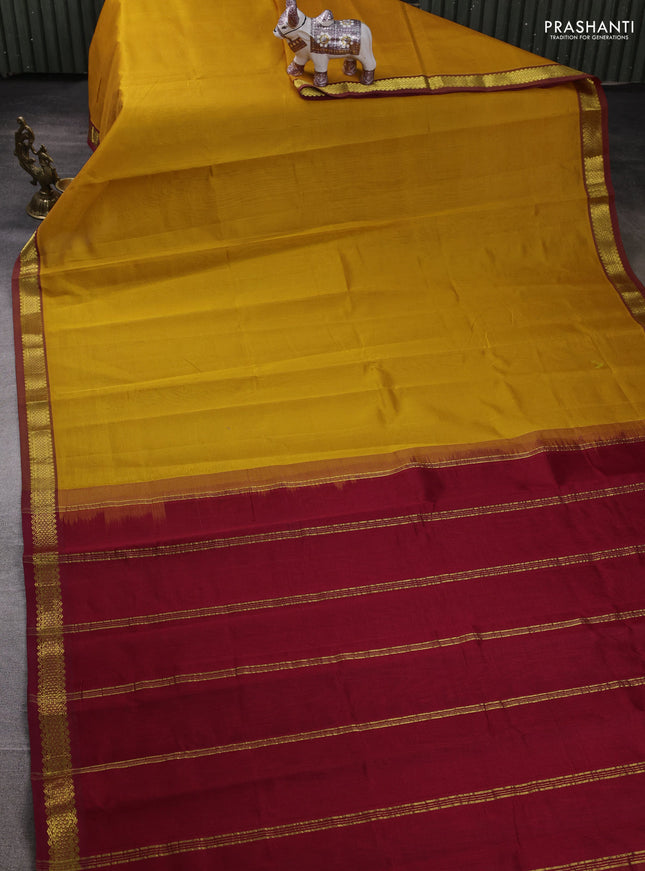 Silk cotton saree mustard yellow and maroon with plain body and zari woven border