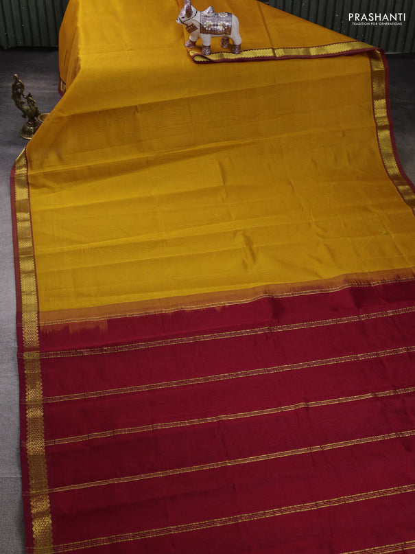 Silk cotton saree mustard yellow and maroon with plain body and zari woven border