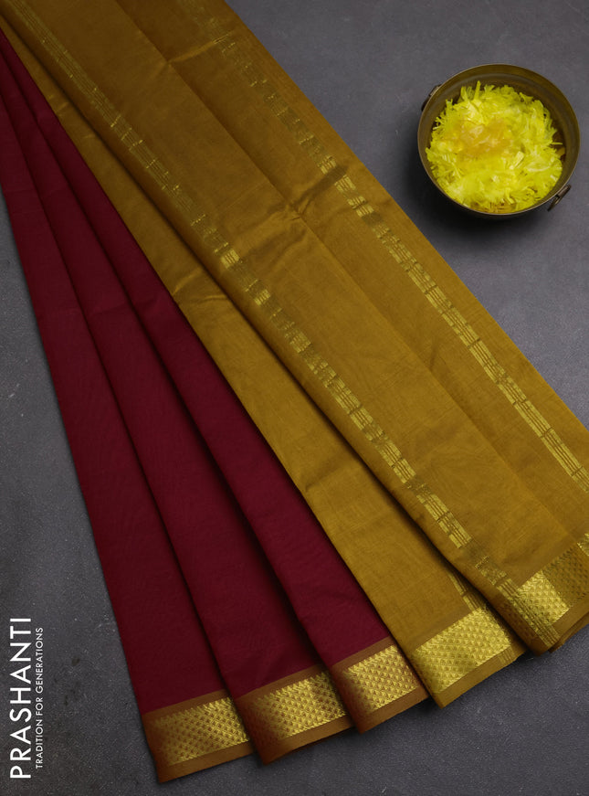 Silk cotton saree maroon and dark mustard with plain body and zari woven border