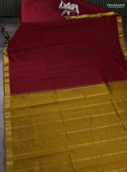 Silk cotton saree maroon and dark mustard with plain body and zari woven border