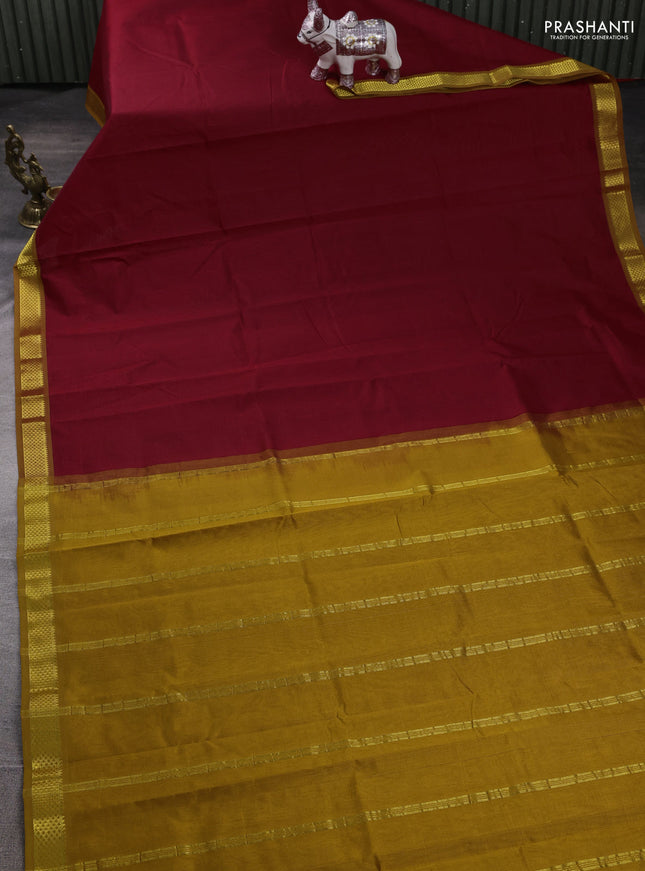 Silk cotton saree maroon and dark mustard with plain body and zari woven border