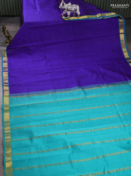 Silk cotton saree blue and teal green with plain body and zari woven border