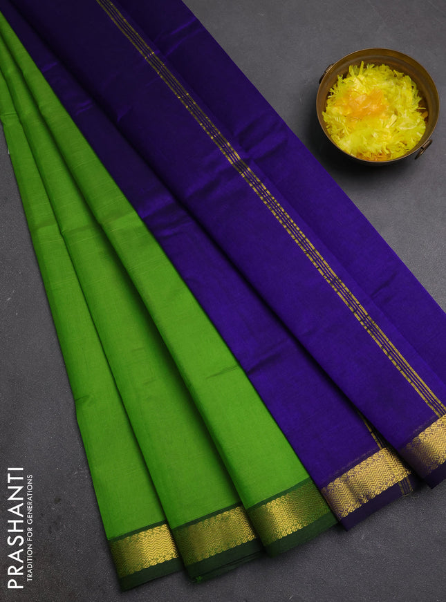 Silk cotton saree parrot green and blue with plain body and zari woven border
