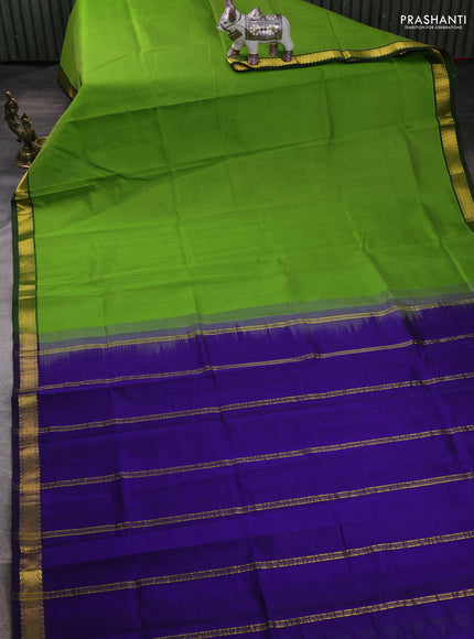 Silk cotton saree parrot green and blue with plain body and zari woven border