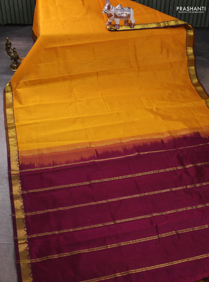 Silk cotton saree mustard yellow and wine shade with plain body and zari woven border