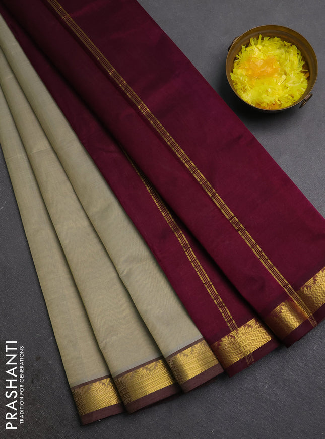 Silk cotton saree beige and wine shade with plain body and zari woven border