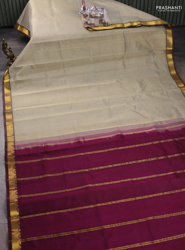 Silk cotton saree beige and wine shade with plain body and zari woven border