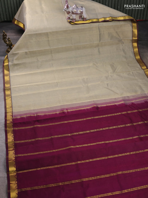 Silk cotton saree beige and wine shade with plain body and zari woven border