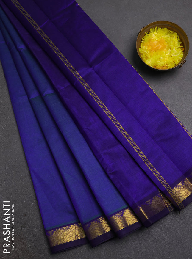 Silk cotton saree dual shade of bluish green and blue with plain body and zari woven border
