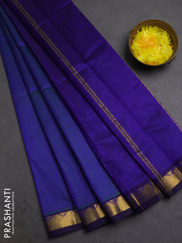 Silk cotton saree dual shade of bluish green and blue with plain body and zari woven border