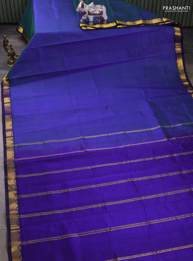 Silk cotton saree dual shade of bluish green and blue with plain body and zari woven border