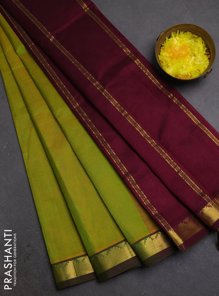 Silk cotton saree mustard green and wine shade with plain body and zari woven border