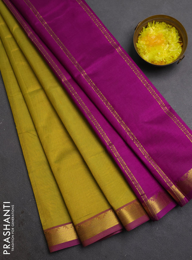 Silk cotton saree mustrad green and purple with plain body and zari woven border