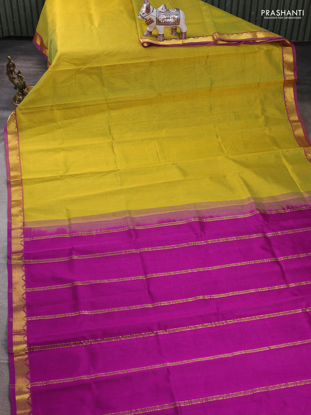 Silk cotton saree mustrad green and purple with plain body and zari woven border