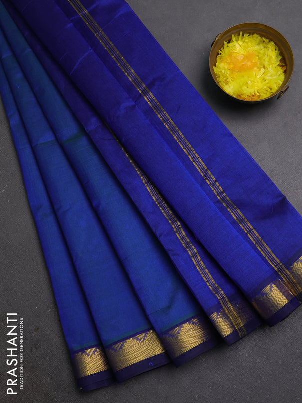 Silk cotton saree dual shade of bluish green and blue with plain body and zari woven border