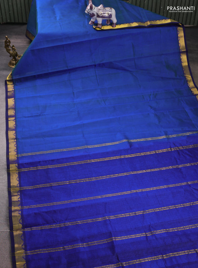 Silk cotton saree dual shade of bluish green and blue with plain body and zari woven border