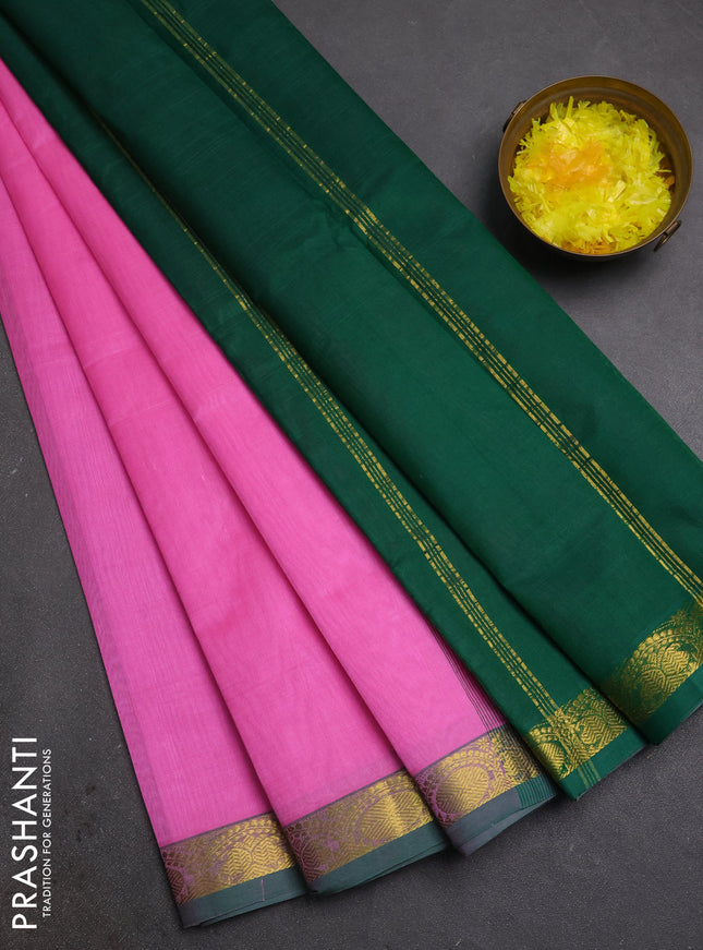 Silk cotton saree light pink and green with plain body and zari woven border
