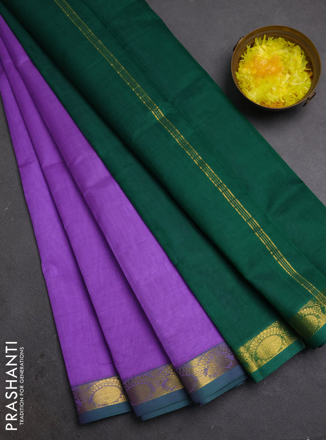Silk cotton saree lavender and green with plain body and zari woven border