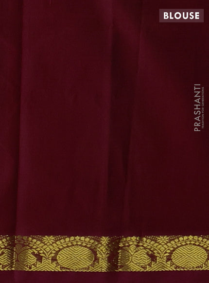 Silk cotton saree bottle green and kumkum red with plain body and zari woven border