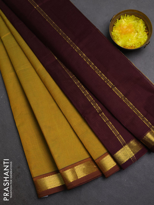 Silk cotton saree dual shade of mustard green and wine shade with allover stripe pattern and zari woven border