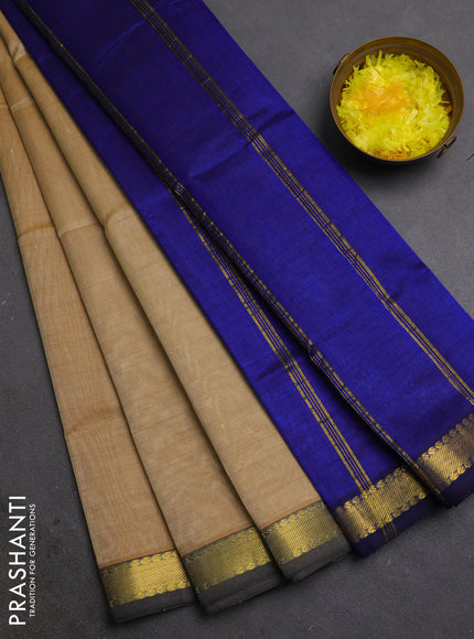 Silk cotton saree sandal and blue with plain body and zari woven border