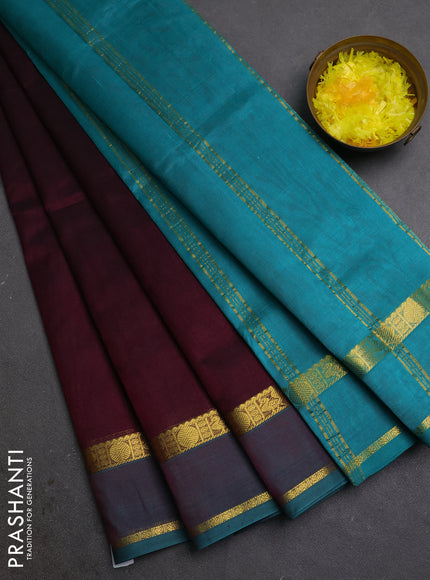 Silk cotton saree wine shade and teal green with plain body and rettapet zari woven border