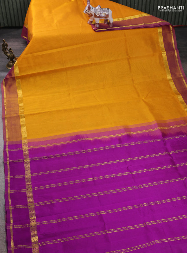 Silk cotton saree mustard yellow and purple with plain body and rettapet zari woven border